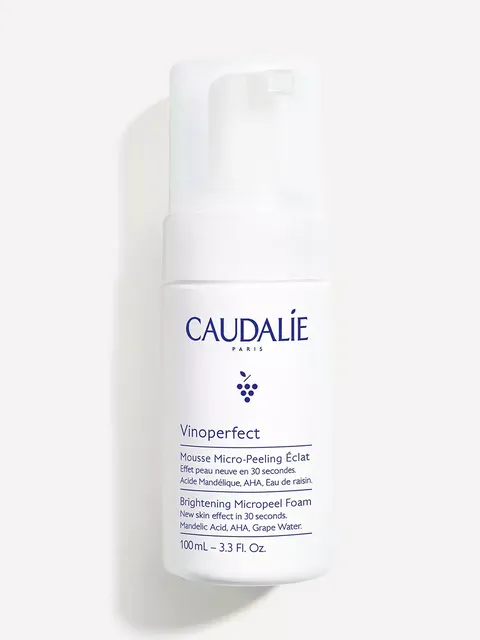 Caudalie Vinoperfect Brightening Micropeel Foam, 100mL bottle, white with blue text.
