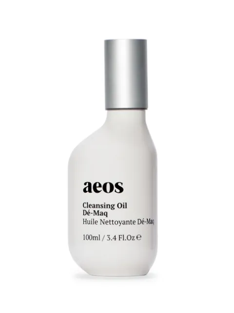 White bottle of aeos Cleansing Oil Dé-Maq, 100ml, with silver cap.
