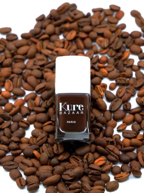 Kure Bazaar nail polish bottle on coffee beans.