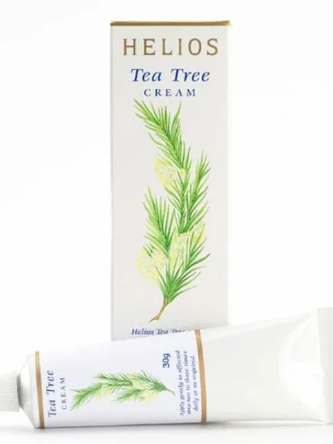 Helios Tea Tree Cream box and tube with green leaf design.
