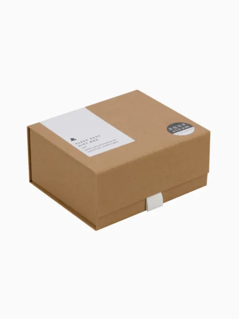 Brown gift box with "Sleep Easy Gift Box" label and round sticker on top.