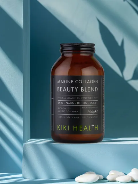 Brown jar of Kiki Health Marine Collagen Beauty Blend on a blue shelf.