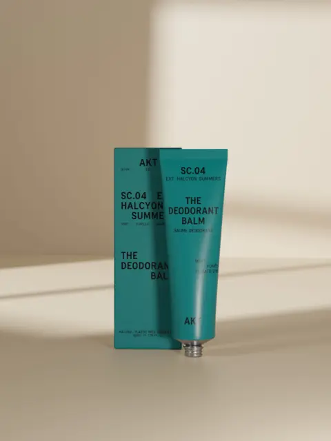Teal deodorant balm tube and box with text "SC.04 Halcyon Summers".