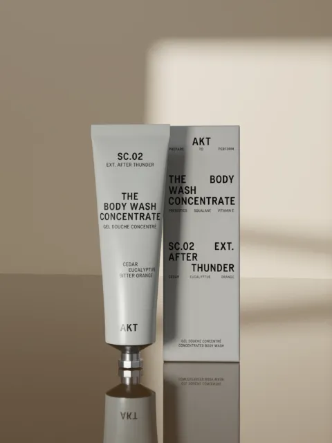 SC.02 Body Wash Concentrate tube and box on a reflective surface. Cedar, eucalyptus, orange scent.