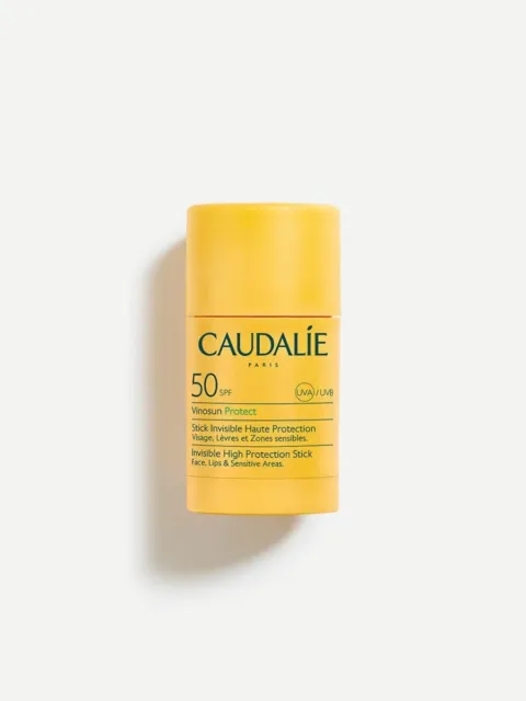 Yellow Caudalie SPF 50 sunscreen stick for face, lips, and sensitive areas.