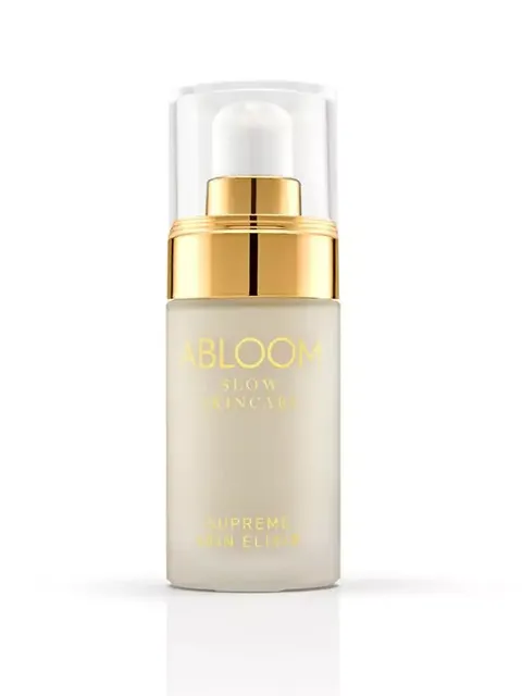 Abloom Supreme Skin Elixir bottle with gold pump and clear cap.