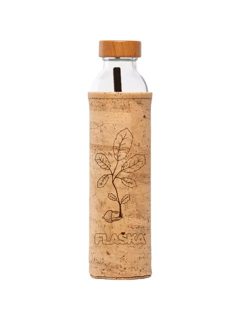 Glass bottle with cork sleeve, wooden cap, and plant design. Text: "FLASKA".