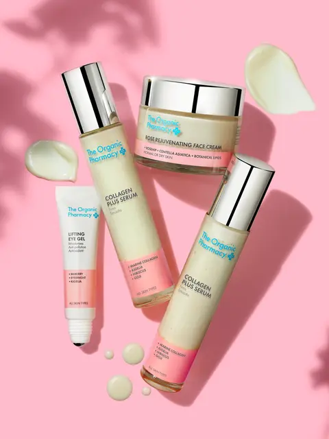 Skincare products on pink background: face cream, serum, eye gel, with cream swatches.