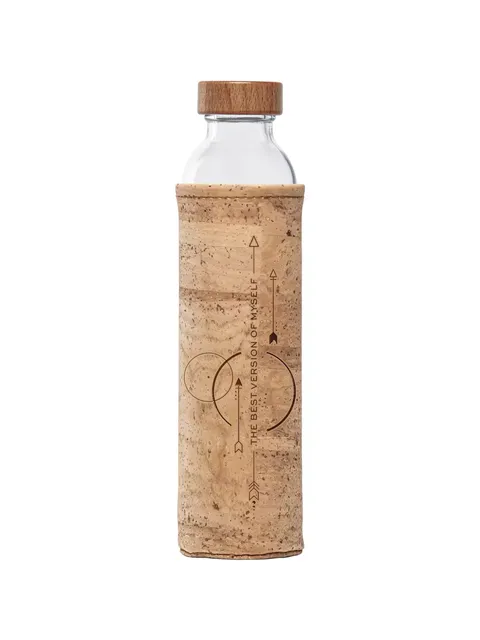 Glass bottle with cork sleeve, wooden lid, and text "The best version of myself" on sleeve.