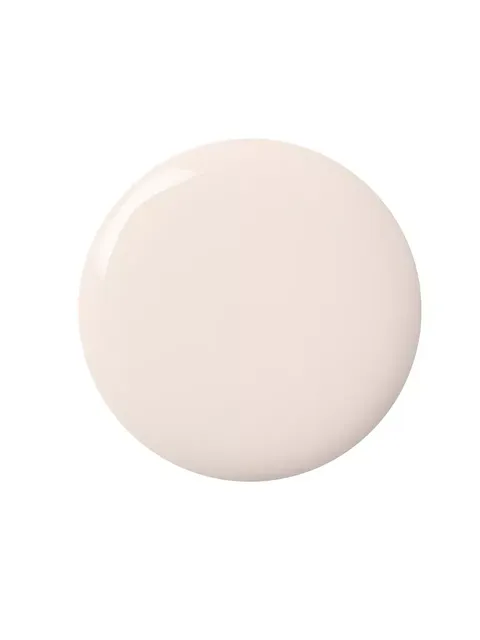Cream-coloured liquid circle on white background.