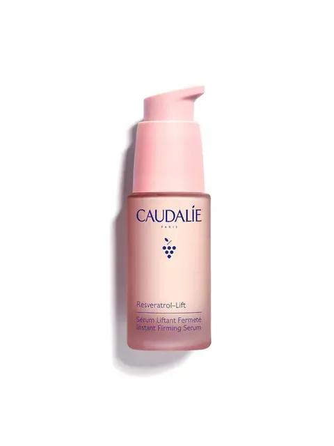 Caudalie Resveratrol-Lift Instant Firming Serum in a pink pump bottle.