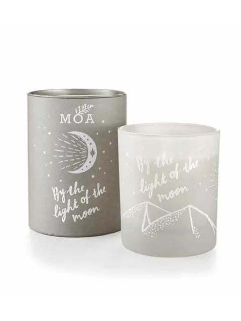 Grey candle holder with "By the light of the moon" text and moon design.