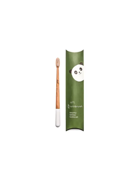 Bamboo toothbrush with white bristles, green packaging with panda illustration, text: "tiny truthbrush".