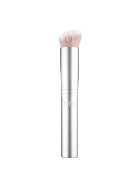 Silver makeup brush with soft bristles and "rms" engraved on the handle.