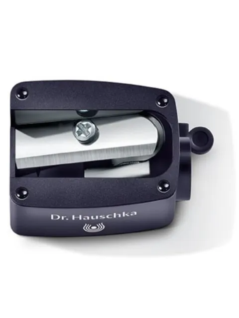 Dr. Hauschka pencil sharpener with visible blade and logo.