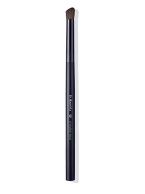 Black angled eyeshadow brush with dark bristles, labelled "Dr. Hauschka Eye Definer Brush".