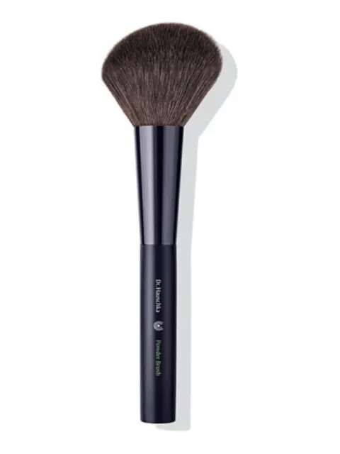 Black powder brush with soft bristles and "Dr. Hauschka Powder Brush" text on handle.