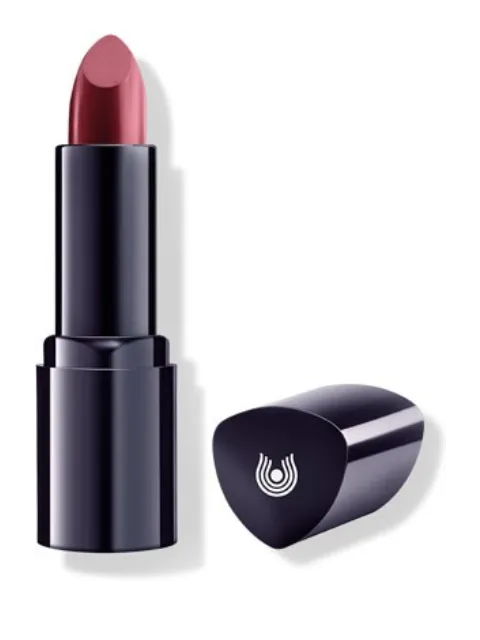 Dark lipstick with a red shade, next to a black cap with a white logo.