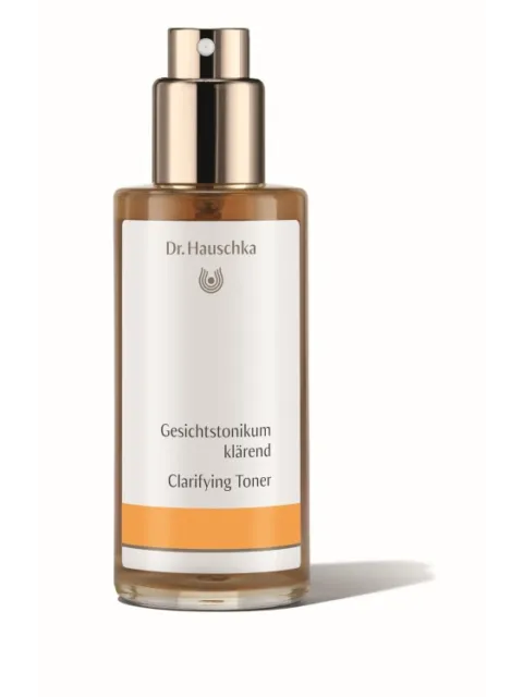 Dr. Hauschka Clarifying Toner bottle with spray top, white and orange label.