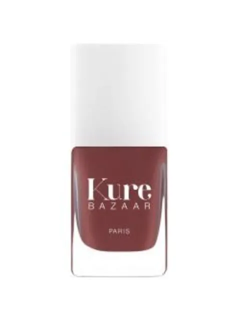 Kure Bazaar nail polish bottle with white cap, red-brown shade.