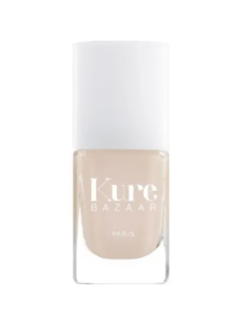 Kure Bazaar nail polish bottle with white cap and beige colour.