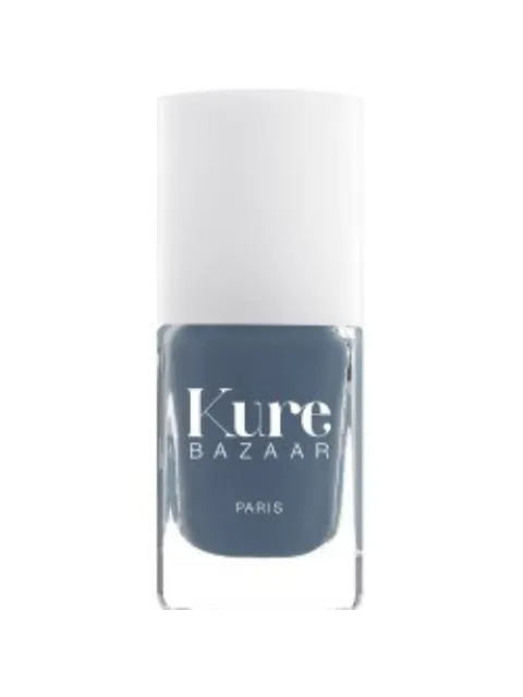 Kure Bazaar nail polish bottle, grey-blue shade, white cap.
