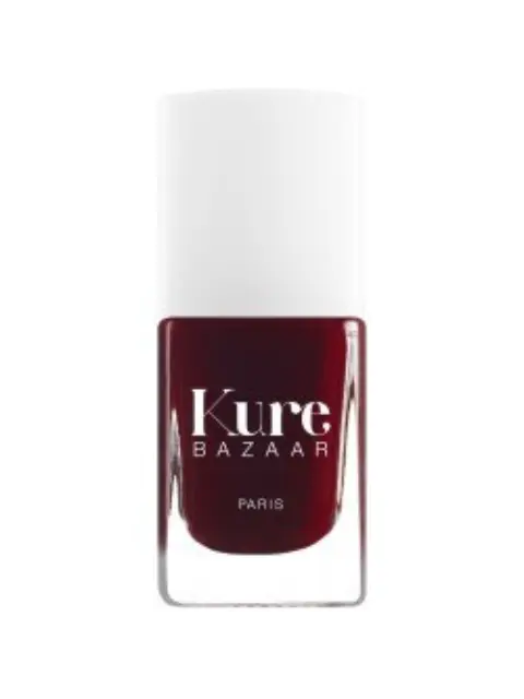 Kure Bazaar nail polish in dark red with white cap.
