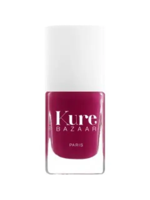 Kure Bazaar nail polish in deep pink shade, white cap.