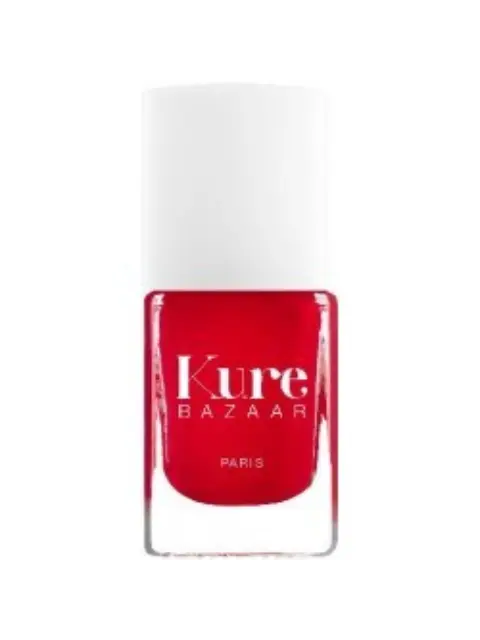 Red nail polish bottle with "Kure Bazaar Paris" text.