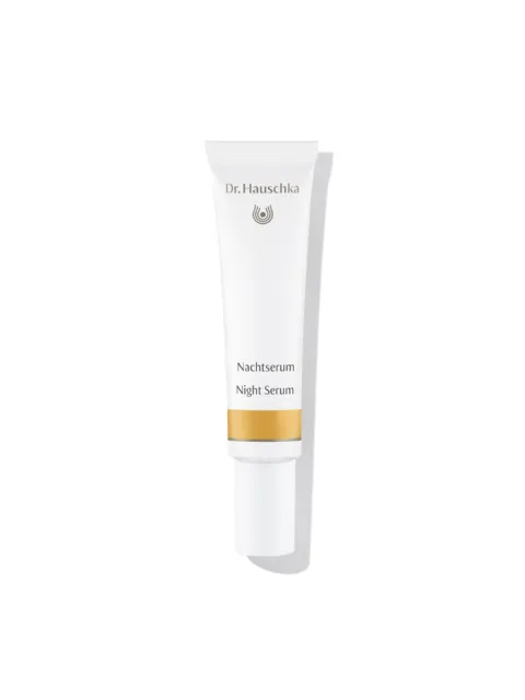 Dr. Hauschka Night Serum tube with gold band, white background.
