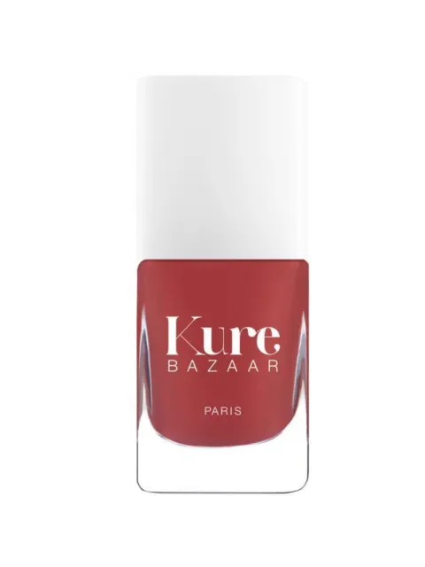Red nail polish bottle with "Kure Bazaar Paris" text.