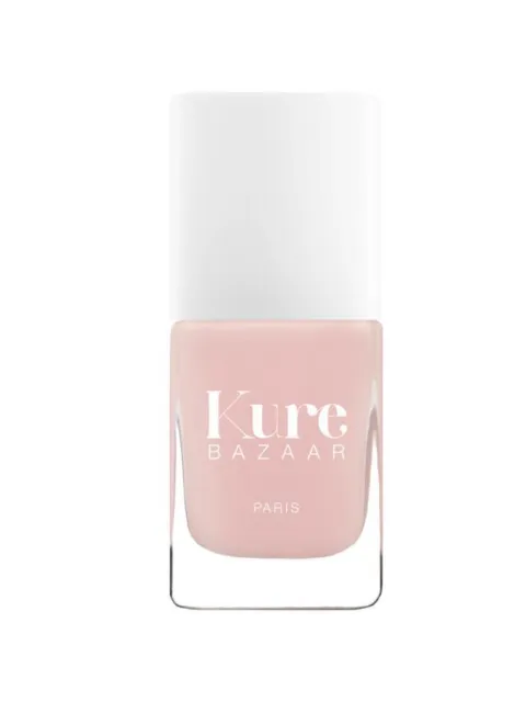 Kure Bazaar nail polish bottle, pale pink shade, white cap.