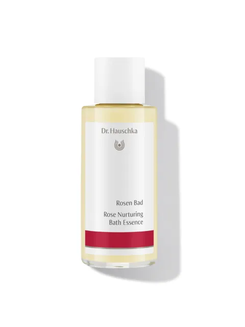 Dr. Hauschka Rose Nurturing Bath Essence bottle with red label.