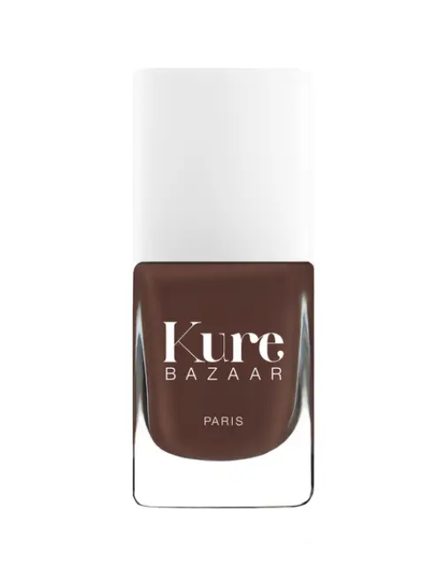 Kure Bazaar nail polish bottle, brown shade, white cap.