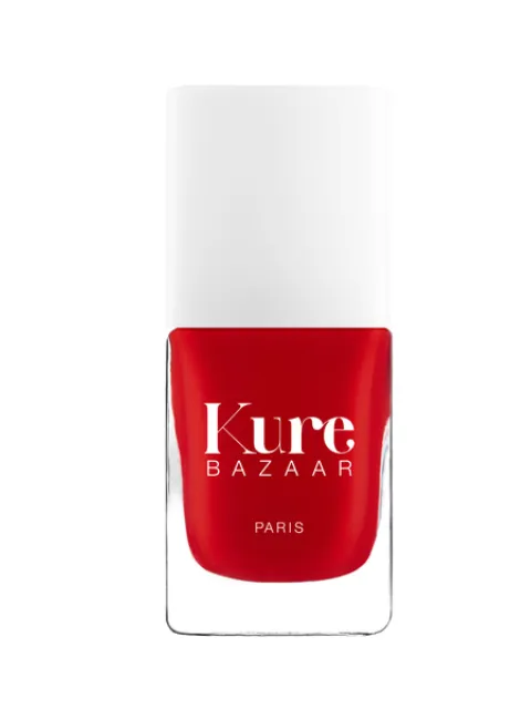 Red nail polish bottle with "Kure Bazaar Paris" text.