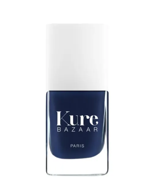Kure Bazaar navy blue nail polish bottle with white cap.
