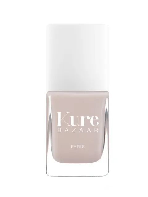 Kure Bazaar nail polish bottle with white cap and beige colour.