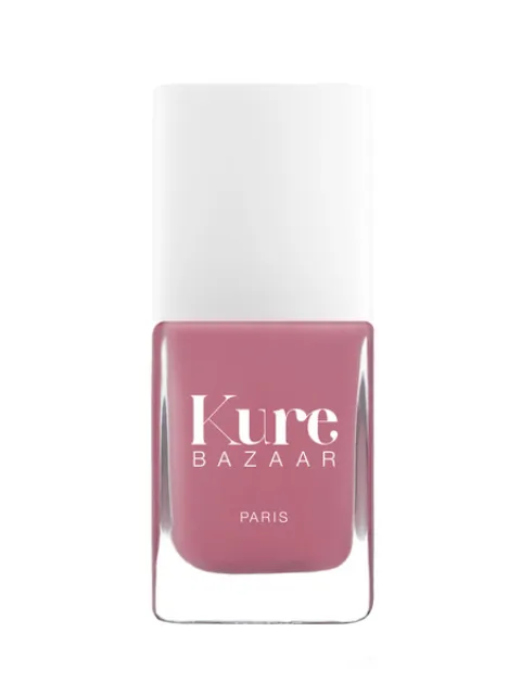 Pink nail polish bottle with "Kure Bazaar Paris" text.