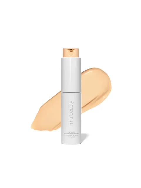 RMS Beauty foundation bottle with beige swatch in background.