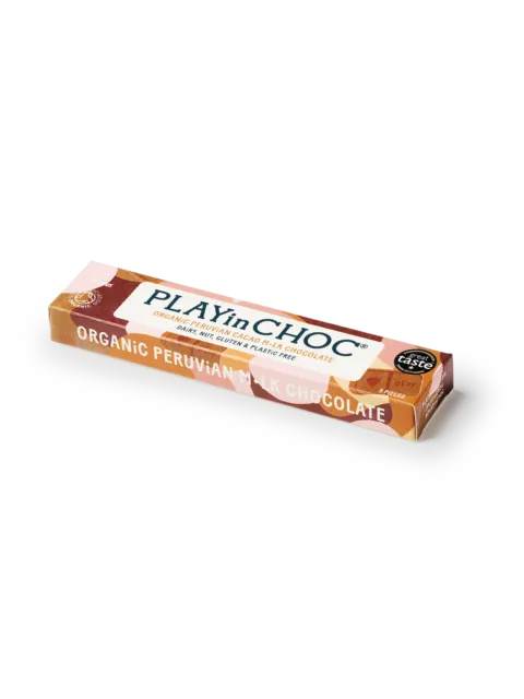 PLAYinCHOC organic Peruvian milk chocolate bar on a white tray.