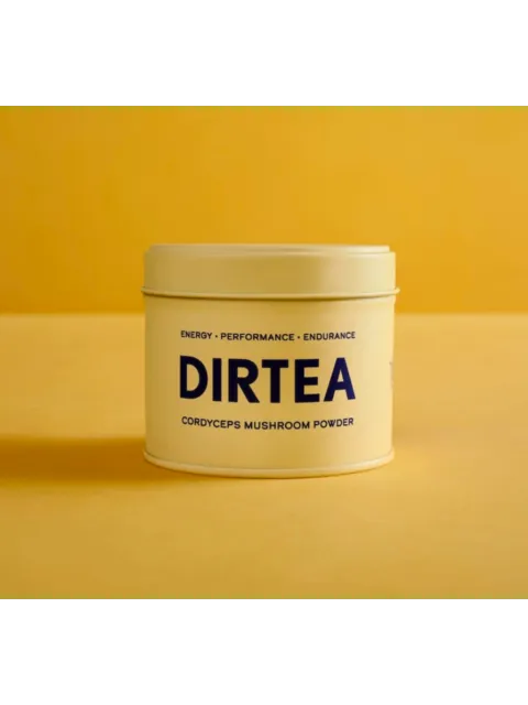 DIRTEA Cordyceps Mushroom Powder tin on yellow background.