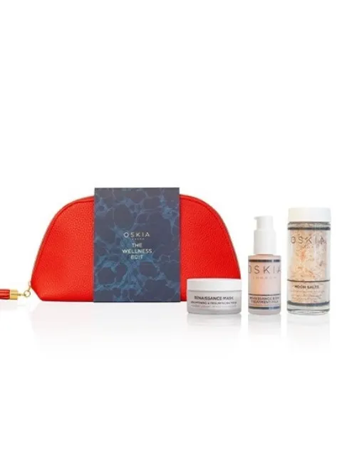 Red pouch with Oskia skincare products: Renaissance Mask, Body Treatment, and Moon Salts.