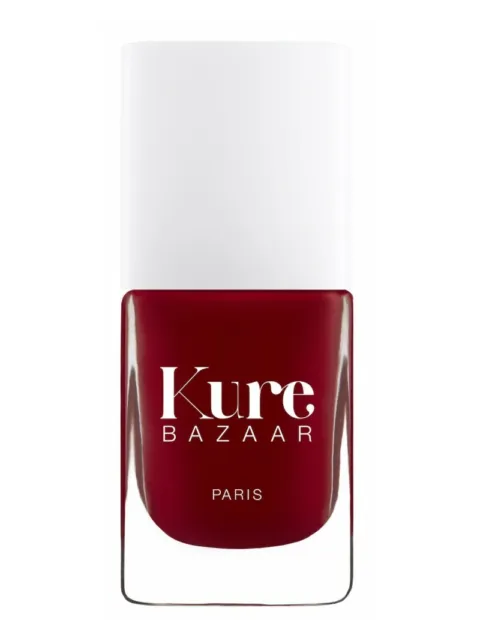 Red nail polish bottle with "Kure Bazaar Paris" text.