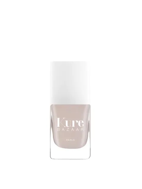 Kure Bazaar nail polish bottle with white cap and beige colour.