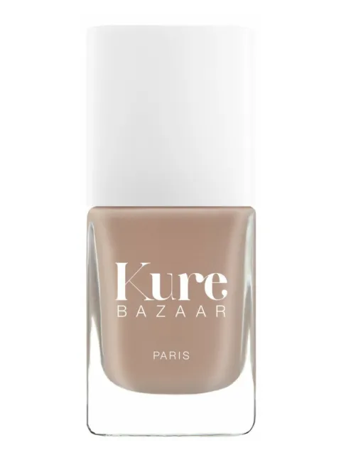 Kure Bazaar nail polish bottle with beige colour and white cap.