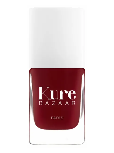 Kure Bazaar Paris nail polish in deep red bottle with white cap.