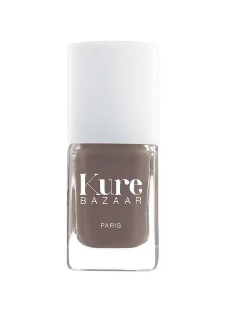 Kure Bazaar nail polish bottle with brown shade and white cap.