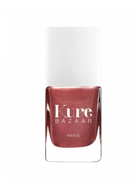 Kure Bazaar Paris nail polish in a shimmery red shade with a white cap.