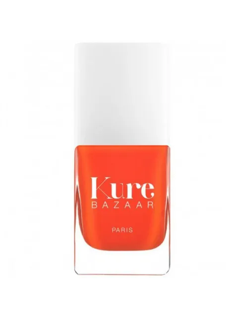 Kure Bazaar orange nail polish bottle with white cap.