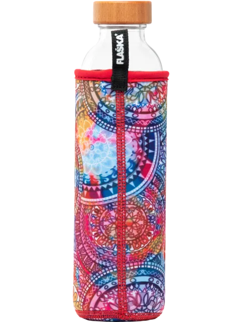 Glass bottle with a wooden cap in a colourful, patterned sleeve with a black "Flaska" label.
